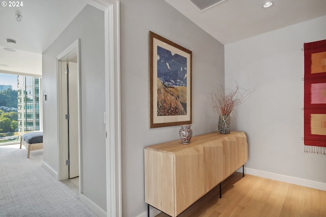 hall with light hardwood / wood-style flooring