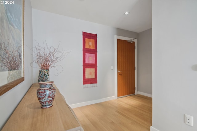 corridor featuring hardwood / wood-style flooring