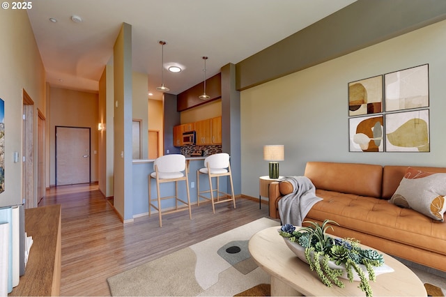1125 NW 9th Ave Unit 524, Portland, OR 97209 - living room with light wood-type flooring and baseboards