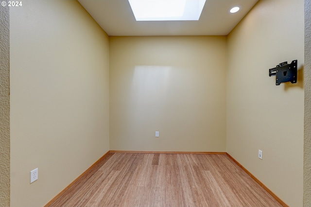 1125 NW 9th Ave Unit 524, Portland, OR 97209 - spare room featuring a skylight, light wood-style flooring, baseboards, and recessed lighting