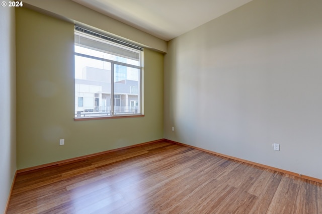 empty room with light hardwood / wood-style floors