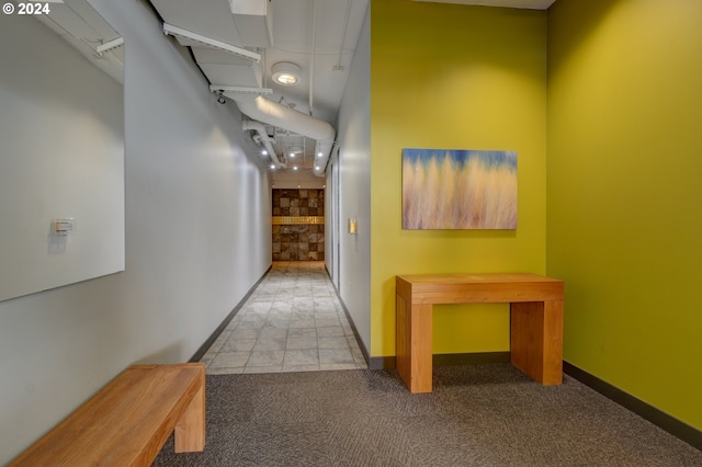 1125 NW 9th Ave Unit 524, Portland, OR 97209 - hallway featuring carpet and baseboards