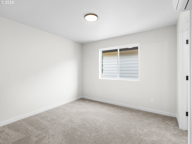 carpeted empty room with a wall mounted air conditioner