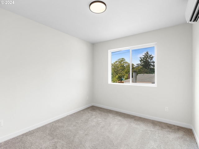 carpeted empty room featuring a wall unit AC