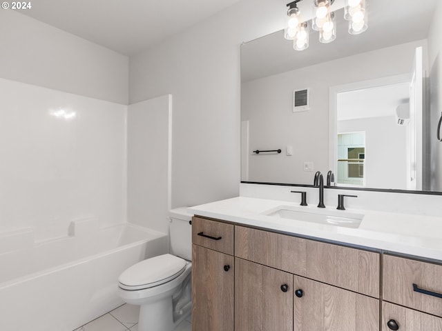 full bathroom with tile patterned floors, washtub / shower combination, toilet, and vanity