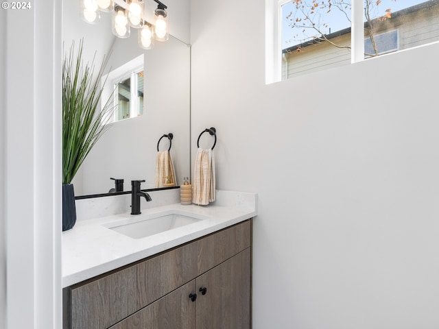 bathroom with vanity and plenty of natural light