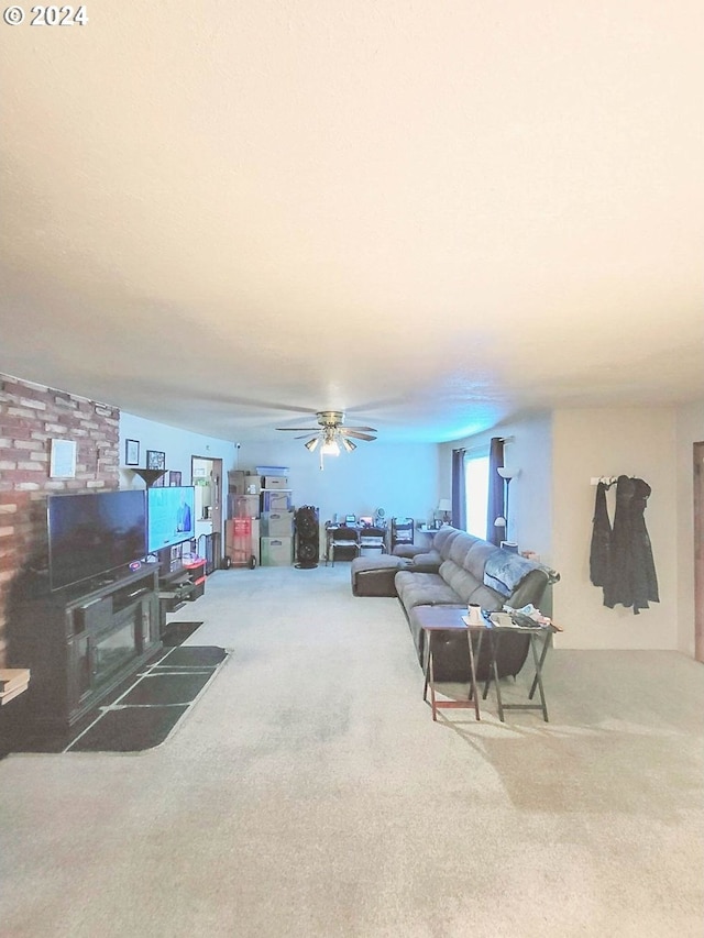 living room featuring ceiling fan and carpet flooring