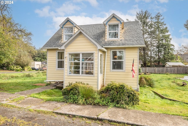 view of front of home with a front lawn