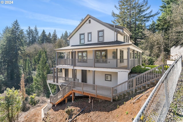 exterior space with a balcony and covered porch