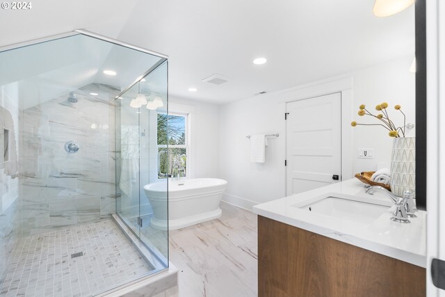 bathroom featuring vanity, tile floors, and separate shower and tub