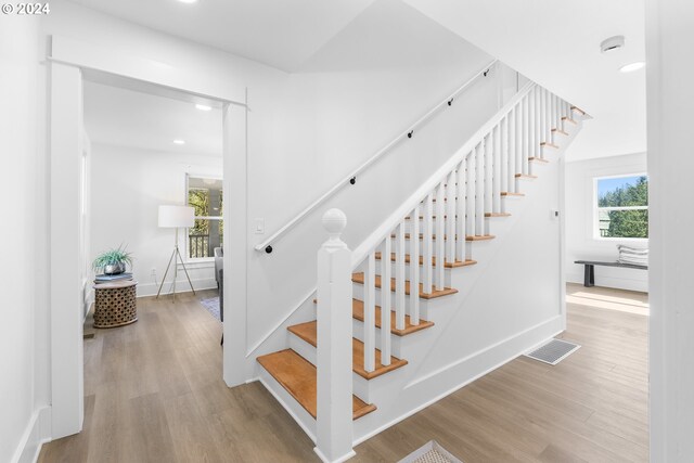 stairs with light wood-type flooring