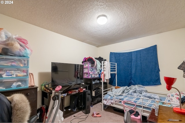 carpeted bedroom with a textured ceiling