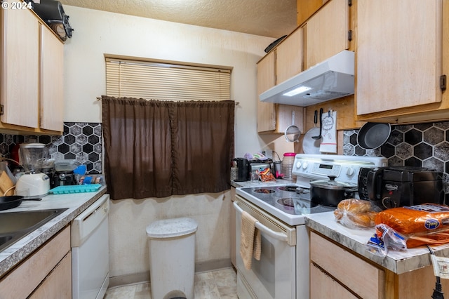 kitchen with a textured ceiling, decorative backsplash, light brown cabinets, and white appliances