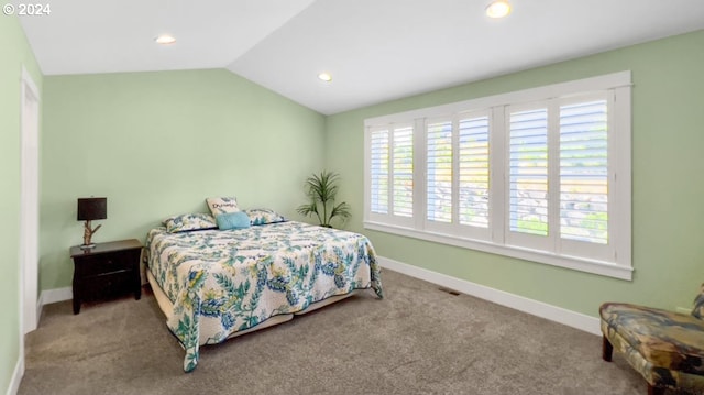 carpeted bedroom with vaulted ceiling