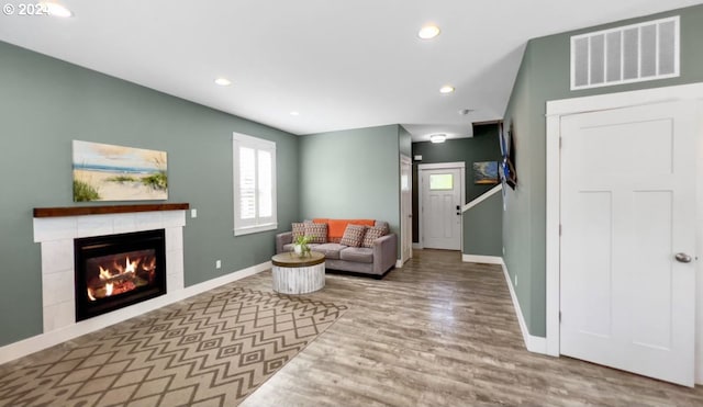 interior space with a fireplace and hardwood / wood-style floors