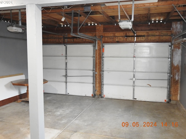 garage featuring a garage door opener