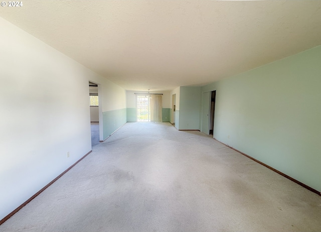 spare room with a textured ceiling