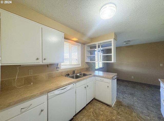 kitchen featuring sink, kitchen peninsula, white dishwasher, a textured ceiling, and white cabinets