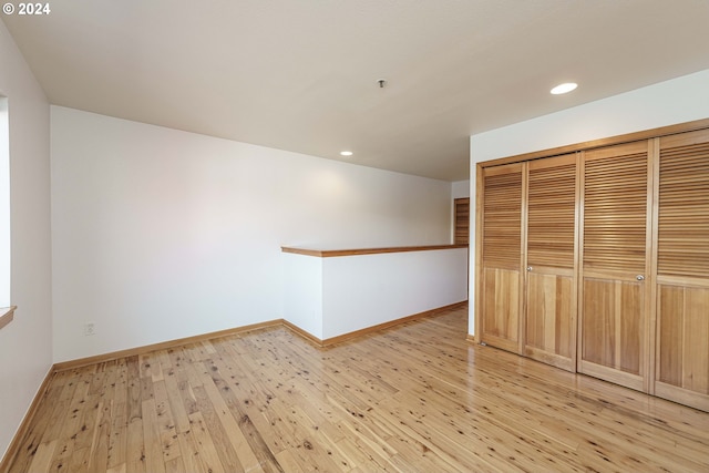 spare room with light wood-type flooring