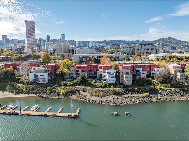 drone / aerial view featuring a water and mountain view