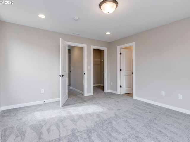 724 NW 178th Way, Ridgefield, WA 98642 - unfurnished bedroom with carpet, baseboards, recessed lighting, and a walk in closet