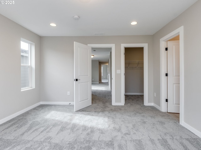 724 NW 178th Way, Ridgefield, WA 98642 - unfurnished bedroom featuring carpet, a spacious closet, baseboards, and recessed lighting