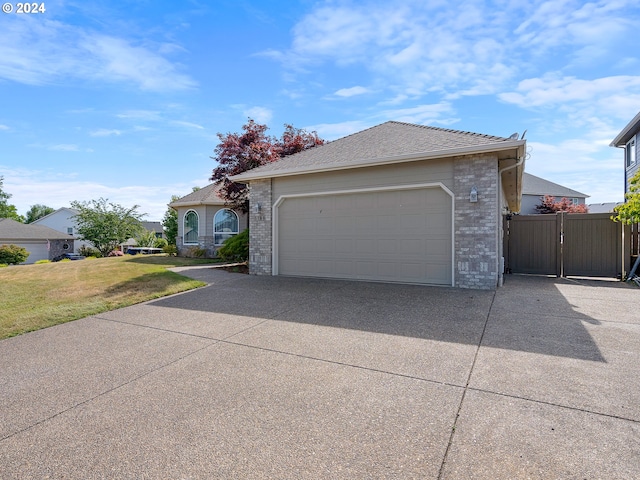 view of front of house with a garage and a front yard