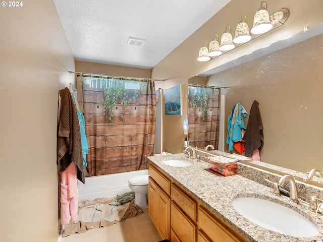 full bathroom featuring a textured ceiling, vanity, shower / tub combo, and toilet