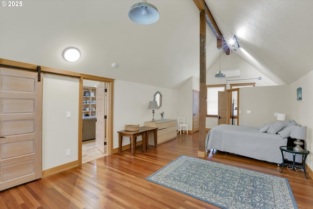 47266 SW Carpenter Creek Rd, Forest Grove, OR 97116 - bedroom featuring a barn door and wood finished floors