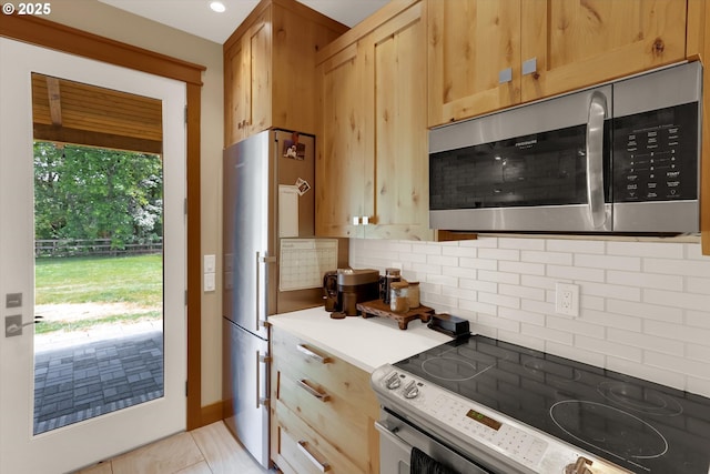 47266 SW Carpenter Creek Rd, Forest Grove, OR 97116 - kitchen with appliances with stainless steel finishes and tasteful backsplash