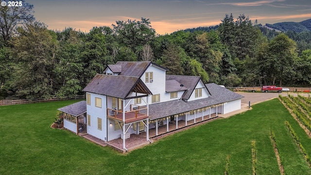 47266 SW Carpenter Creek Rd, Forest Grove, OR 97116 - back of property featuring a detached garage, a wooded view, and roof with shingles