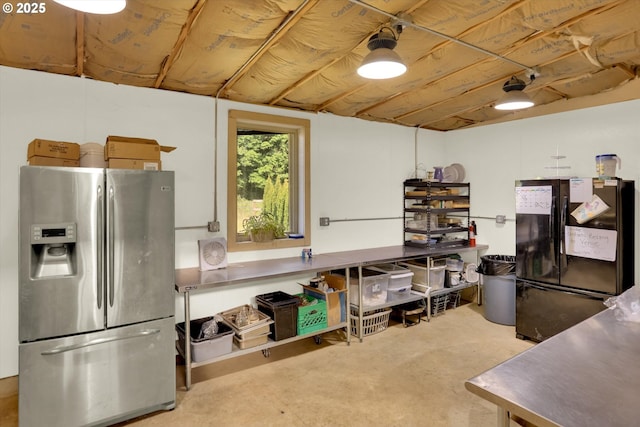 47266 SW Carpenter Creek Rd, Forest Grove, OR 97116 - kitchen with stainless steel fridge with ice dispenser, freestanding refrigerator, concrete floors, and stainless steel countertops