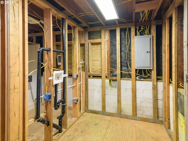 unfinished basement featuring electric panel