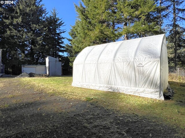 view of outdoor structure with a lawn