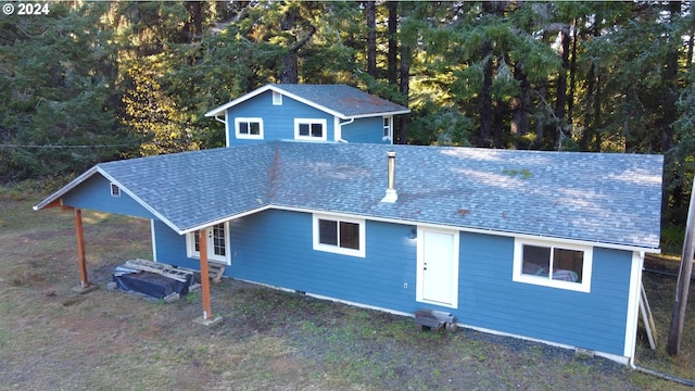 ranch-style house with a shingled roof