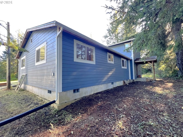 view of home's exterior featuring crawl space