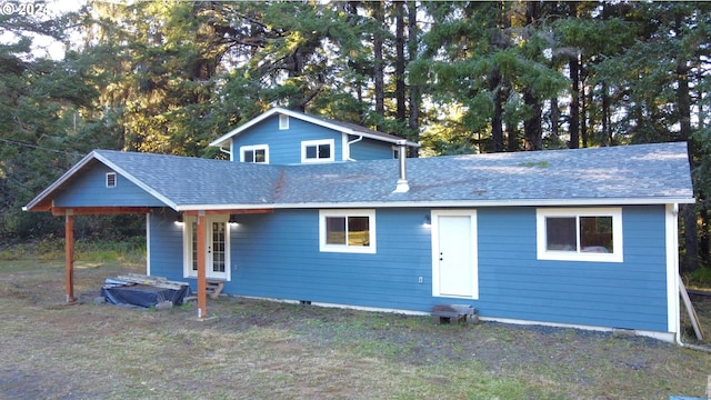 view of front of home featuring a shingled roof