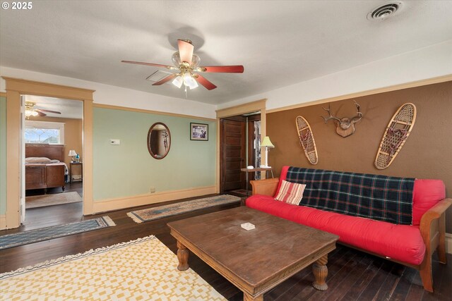 living area featuring wood-type flooring and an inviting chandelier