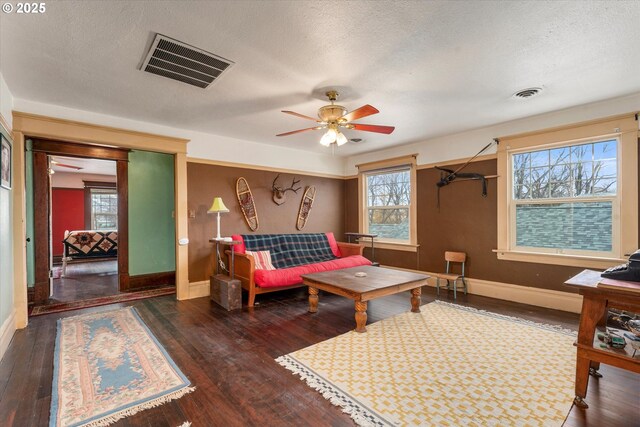 living area featuring dark wood-type flooring