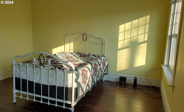 bedroom featuring dark hardwood / wood-style floors