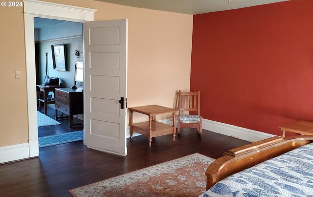 bedroom featuring dark hardwood / wood-style flooring