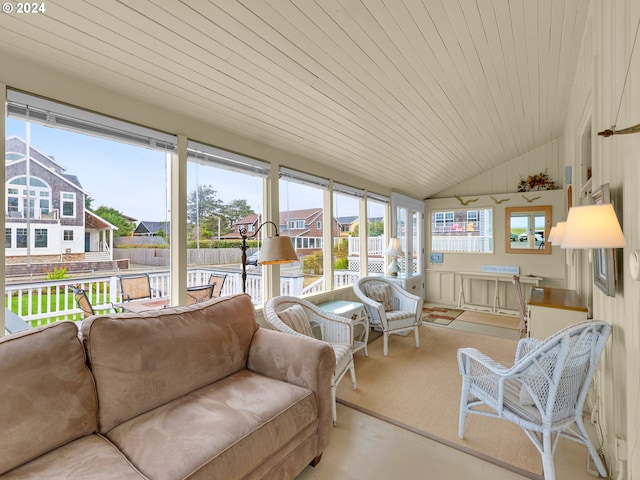 sunroom / solarium with a wealth of natural light, lofted ceiling, and wood ceiling