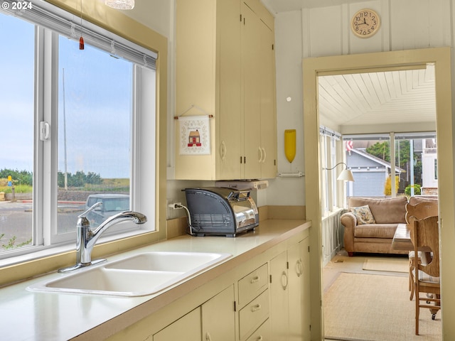 kitchen with light tile patterned flooring and sink