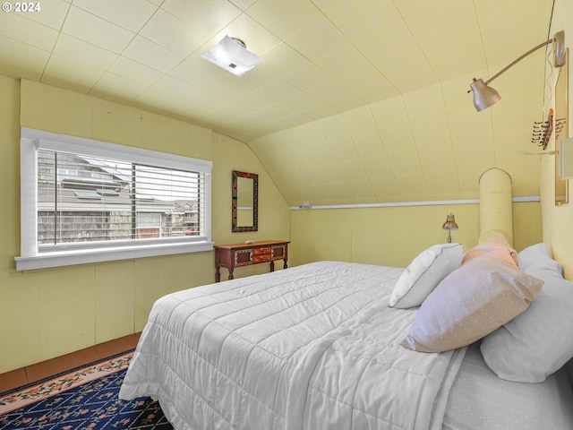 bedroom featuring wood-type flooring and lofted ceiling