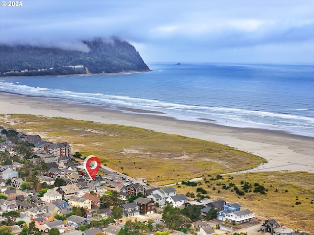 aerial view featuring a water view and a view of the beach