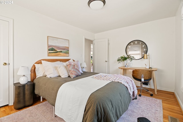 bedroom with light hardwood / wood-style floors