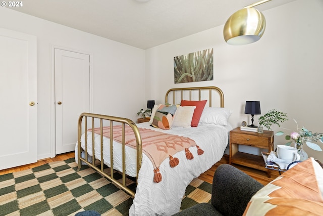 bedroom with hardwood / wood-style floors