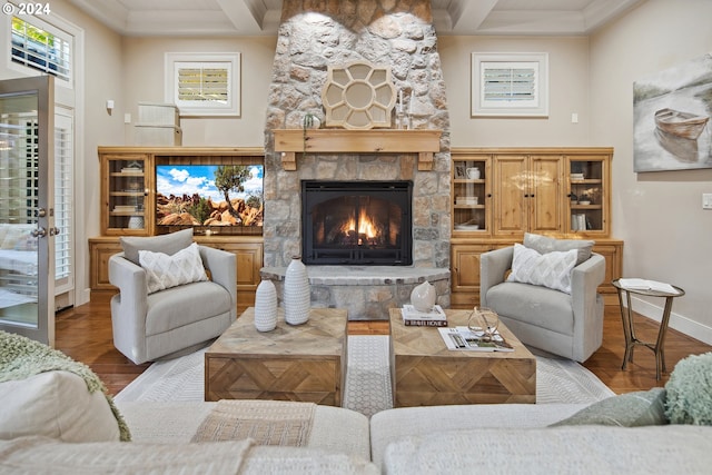 815 E Ave, Lake Oswego, OR 97034 - living area with baseboards, a stone fireplace, crown molding, wood finished floors, and beamed ceiling