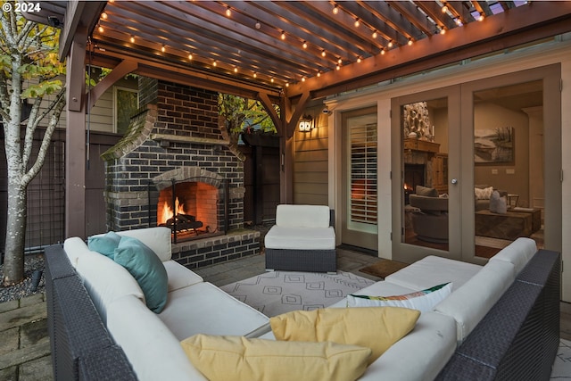 view of patio / terrace with an outdoor living space with a fireplace