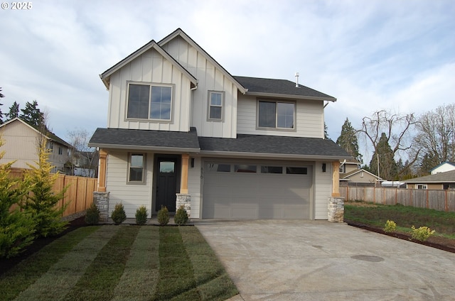 view of front facade with a front yard and a garage